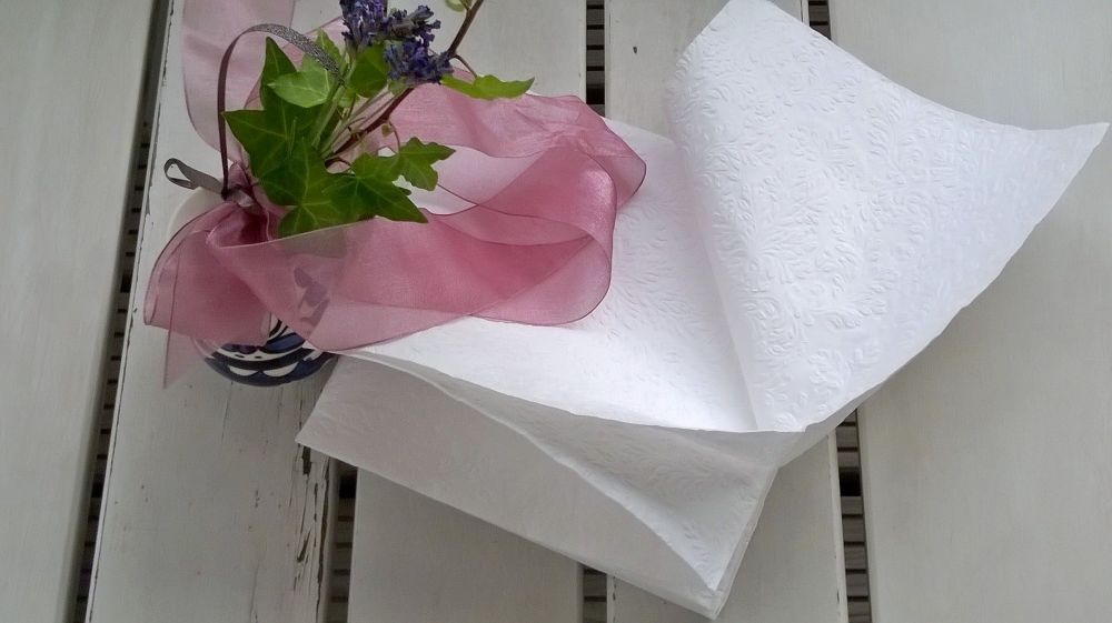 Some wind lifts the napkins gently